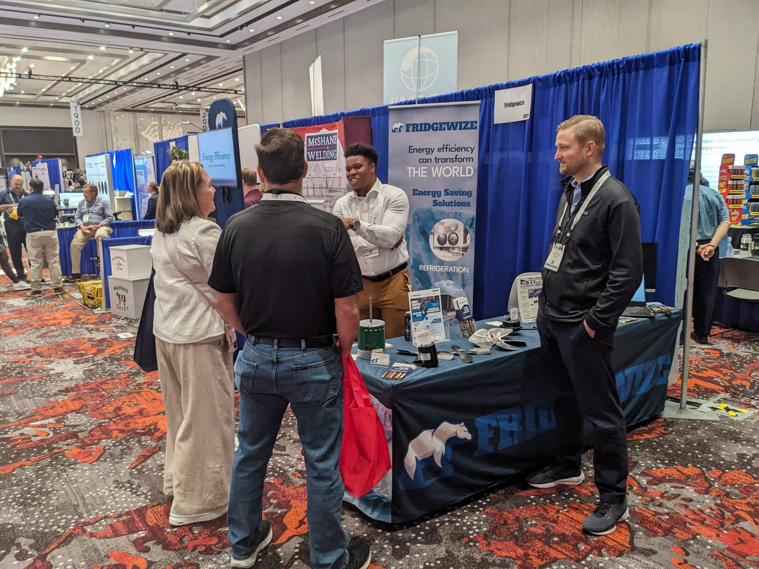 AJ and Paul talking with fellow attendees at the NGA Show